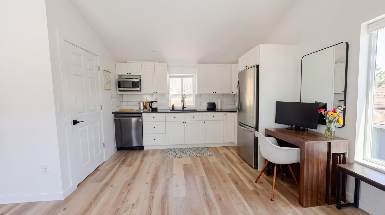 Full-size kitchen with custom cabinetry and quartz countertops in a Denver garage ADU rental